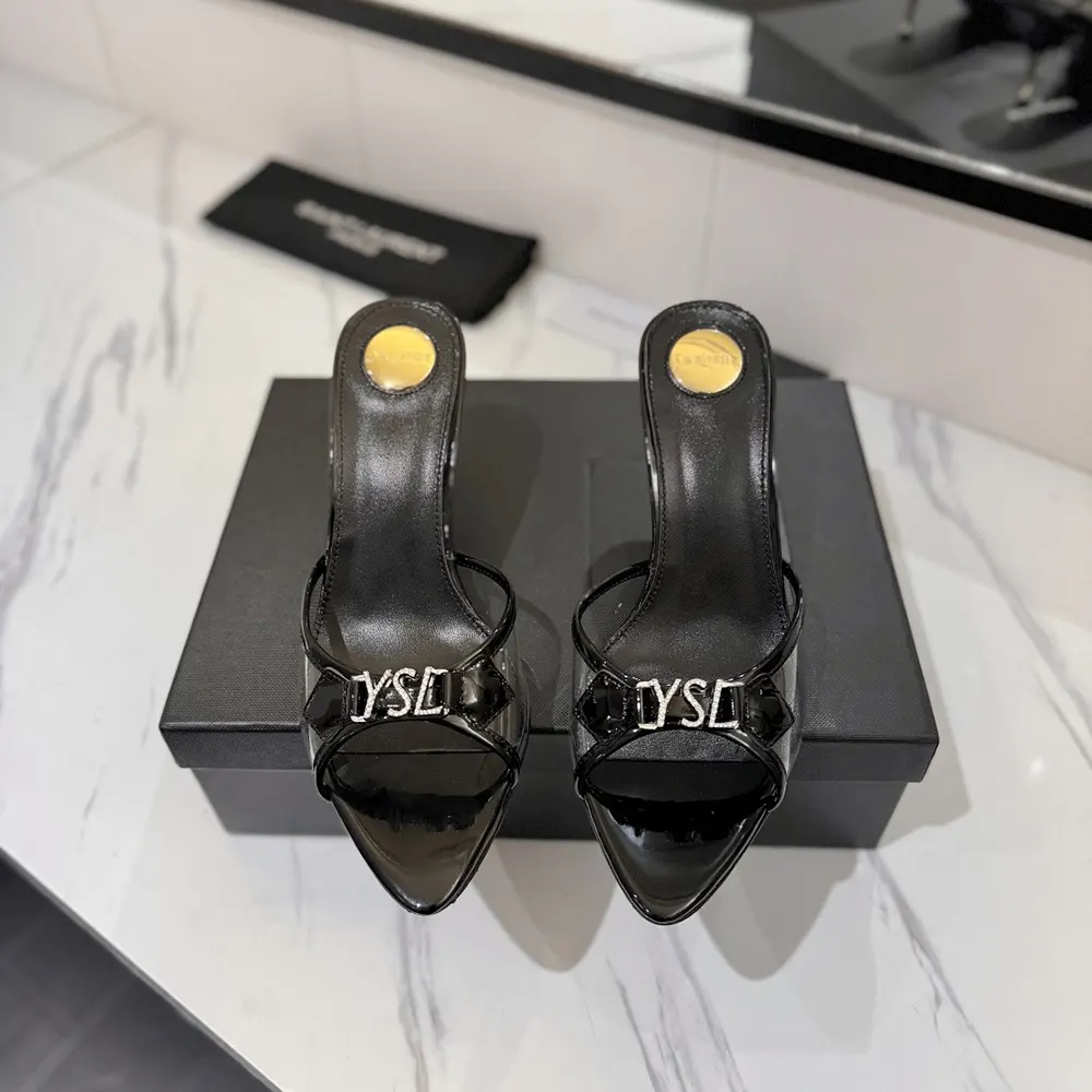 Close-up of rhinestone-studded YSL logo on Saint Laurent Jerry mules