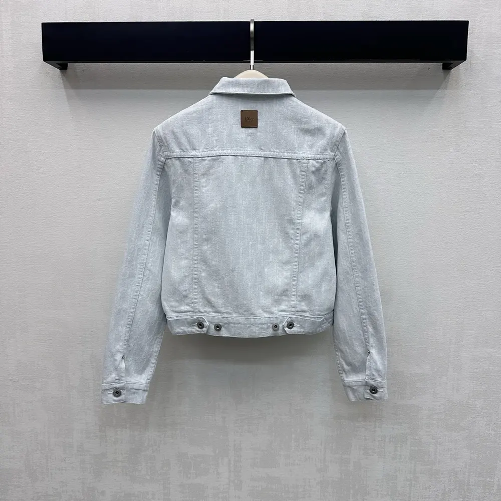 Side angle showing cropped silhouette and button closure details