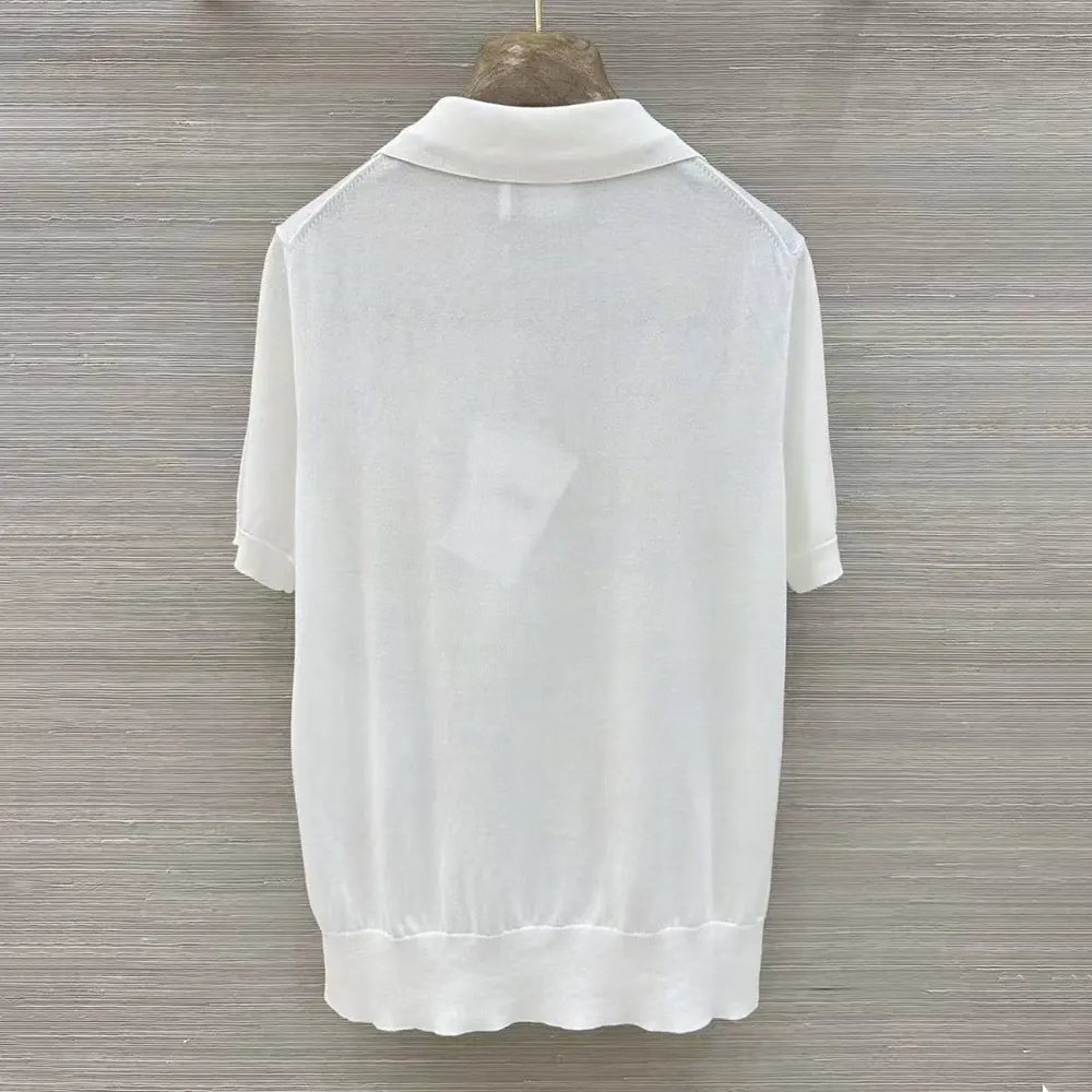 Side angle showing silhouette of Dior Women Dioriviera Dior Médaillon Short-Sleeved Sweater