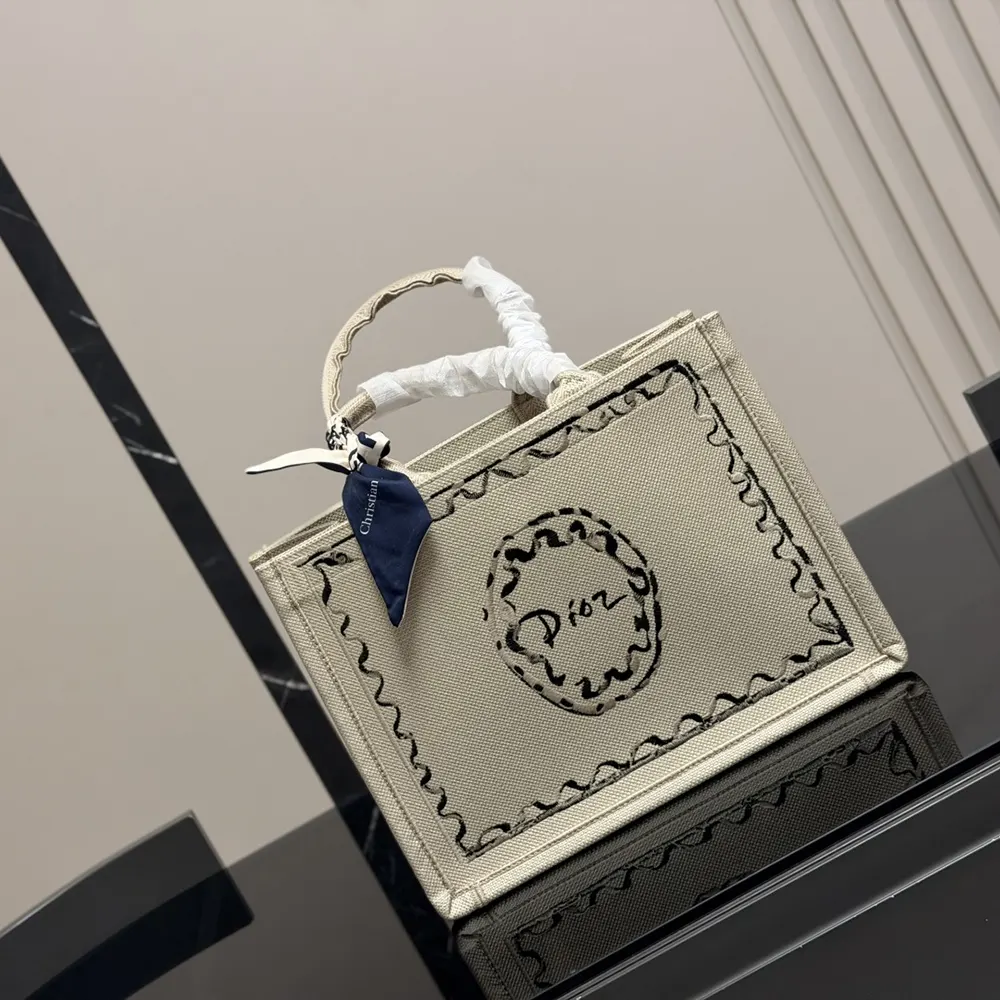 Side angle showing strap detail on Dior Women Dioriviera Medium tote