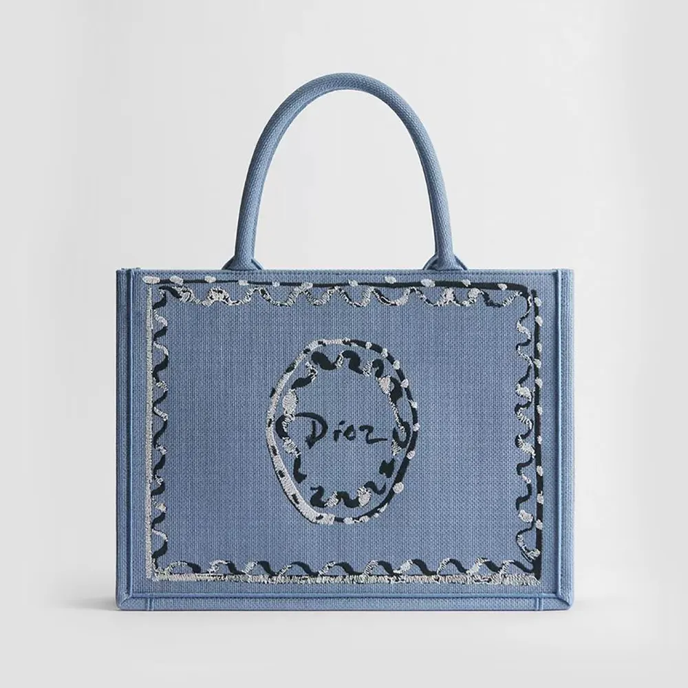 Front view of Dior Women Dioriviera Medium Dior Book Tote with painted ribbon embroidery