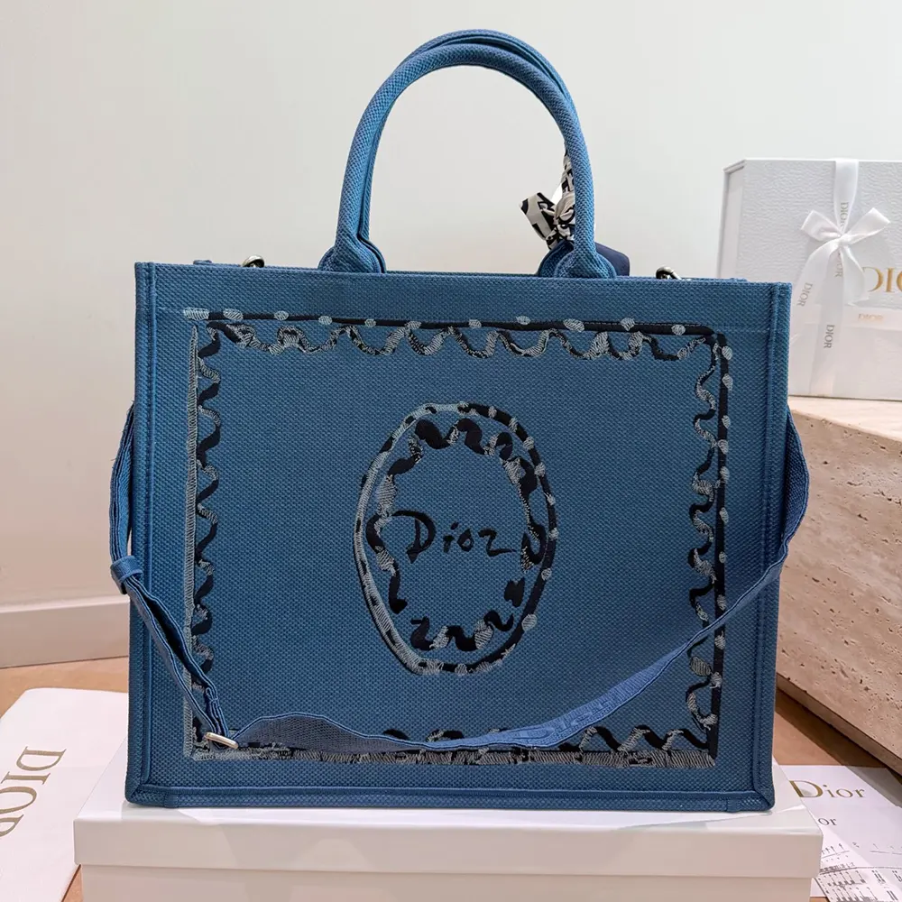 Side profile showing detachable strap on Dior Women Dioriviera Medium Dior Book Tote