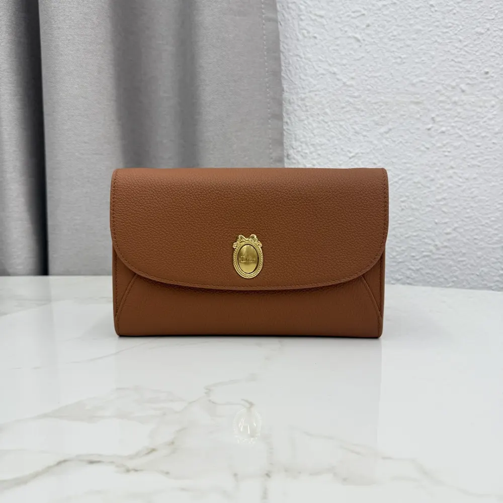 Side angle showing strap and grain detail on Dior Women Médaillon Envelope Pouch