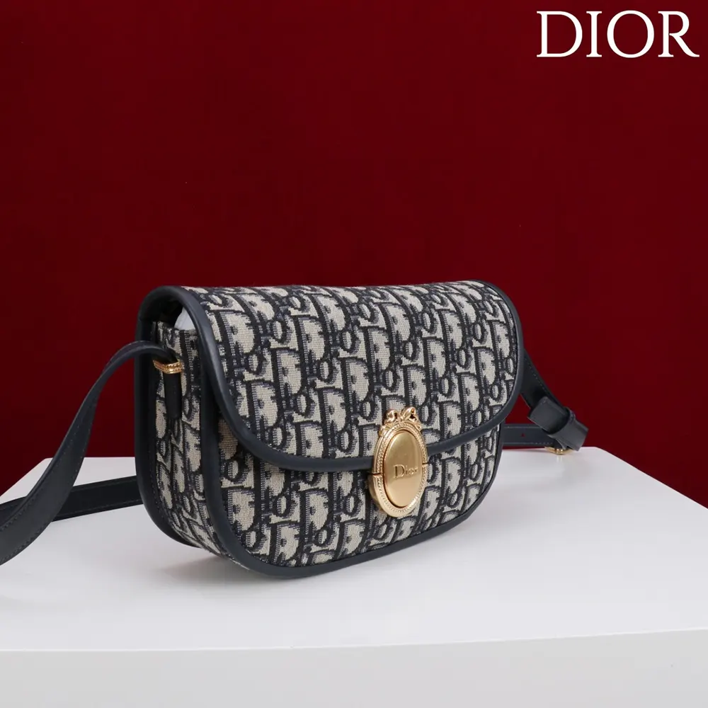 Side angle showing flap closure and jacquard texture on Dior Women Medium Dior Médaillon Flap Bag
