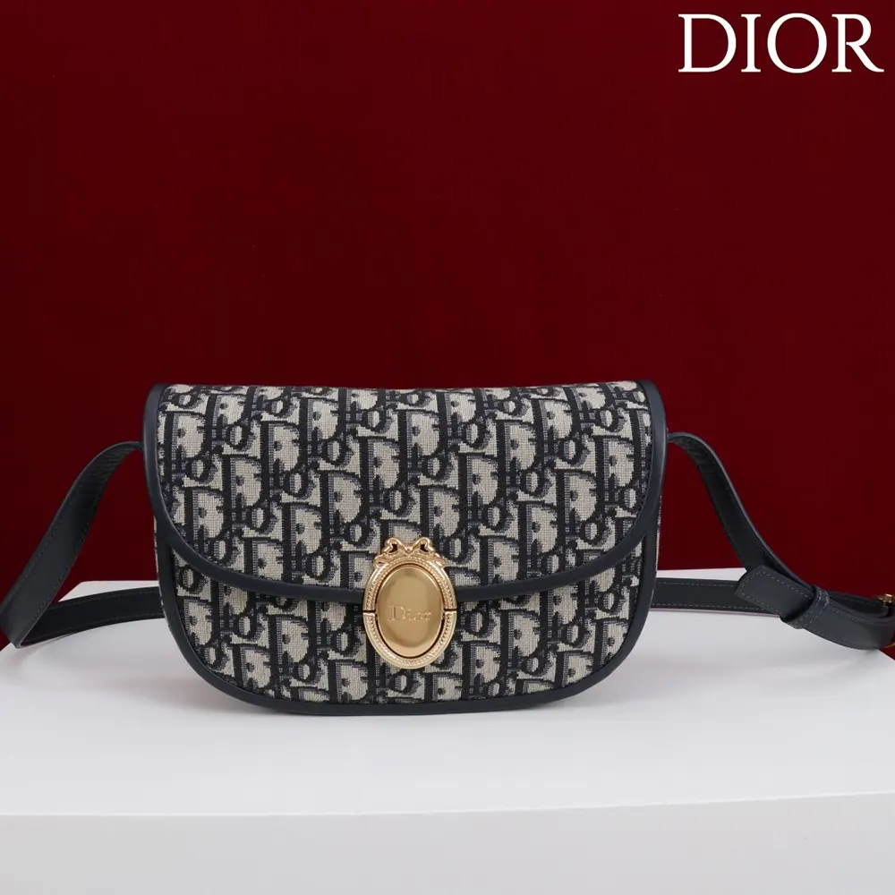 Close-up of silver Médaillon hardware on Dior Women Medium Dior Médaillon Flap Bag