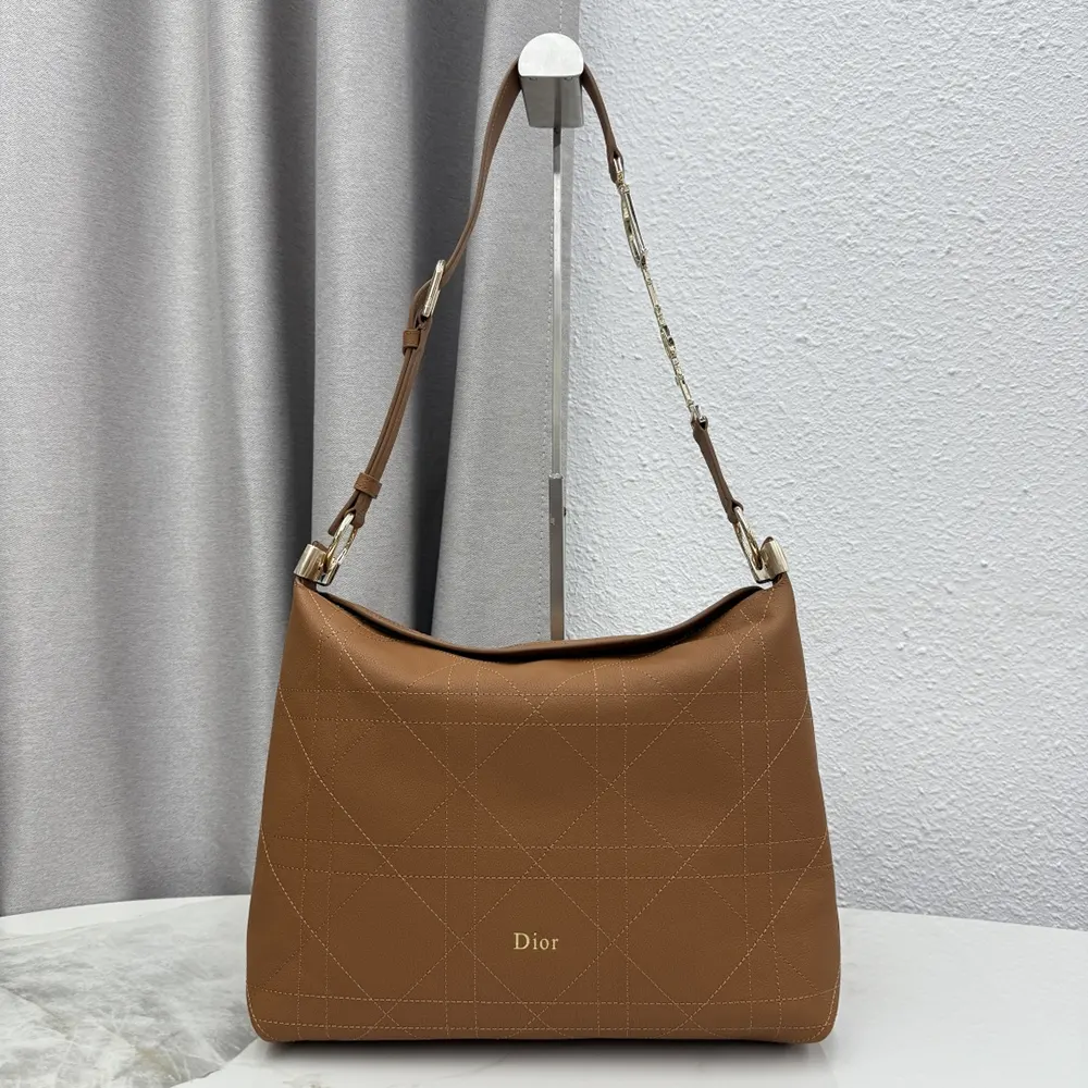 Close-up of Macrocannage stitching on brown grained calfskin Dior bag