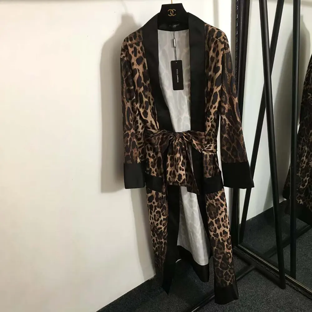 Close-up of embroidered D&G logo on black cotton bath robe pocket
