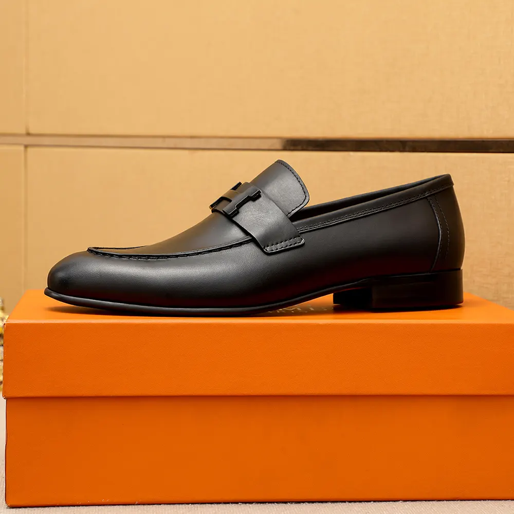 Close-up of polished Hermes hardware on Men Honore Loafer