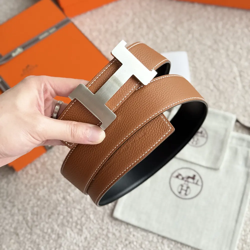 Styled shot of Hermes Unisex Constance Belt Buckle & Reversible Leather Strap 38 mm on outfit
