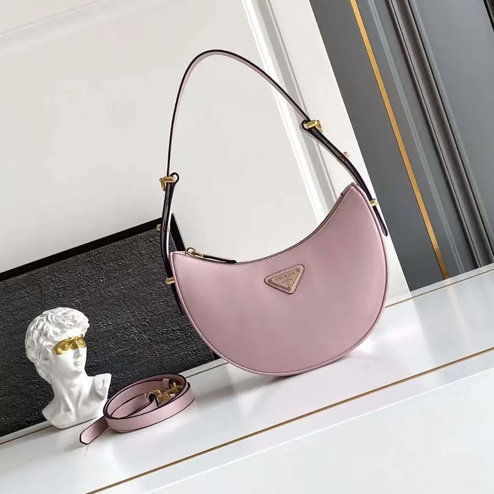 Close-up of silver hardware on Prada Women Arqué Mini Leather Shoulder Bag-Pink