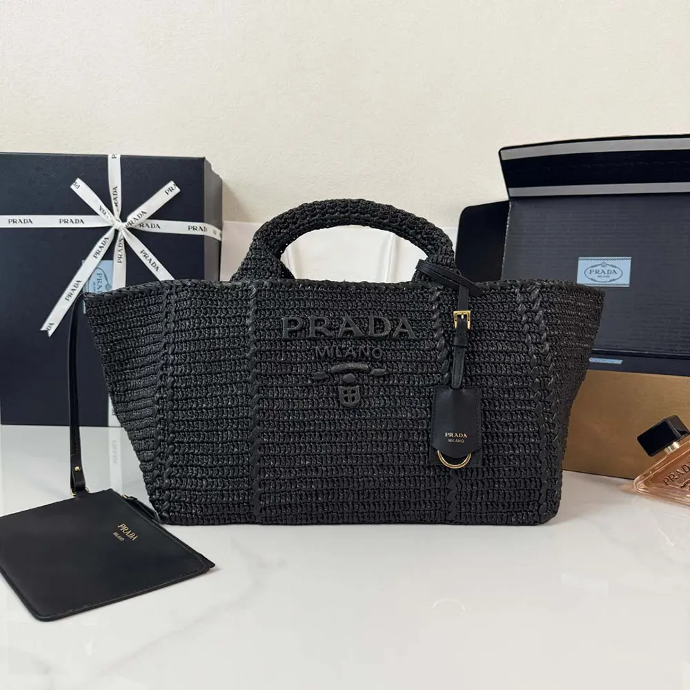 Close-up of leather trims and silver-tone hardware on Prada crochet tote
