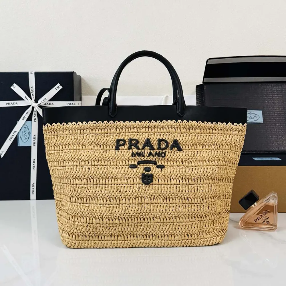 Close-up of black leather and crochet detail on Prada tote bag