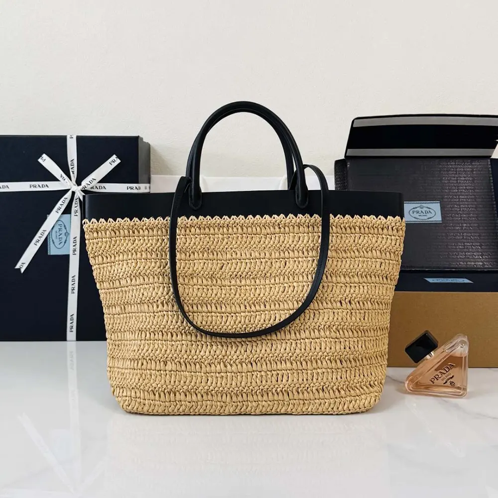 Side angle showing gold hardware on Prada Women Medium Crochet and Leather Tote Bag-Black