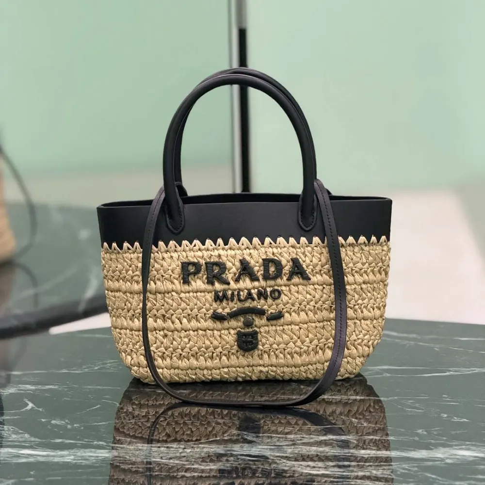 Close-up of gold-tone hardware on Prada Women Mini Crochet and Leather Tote Bag