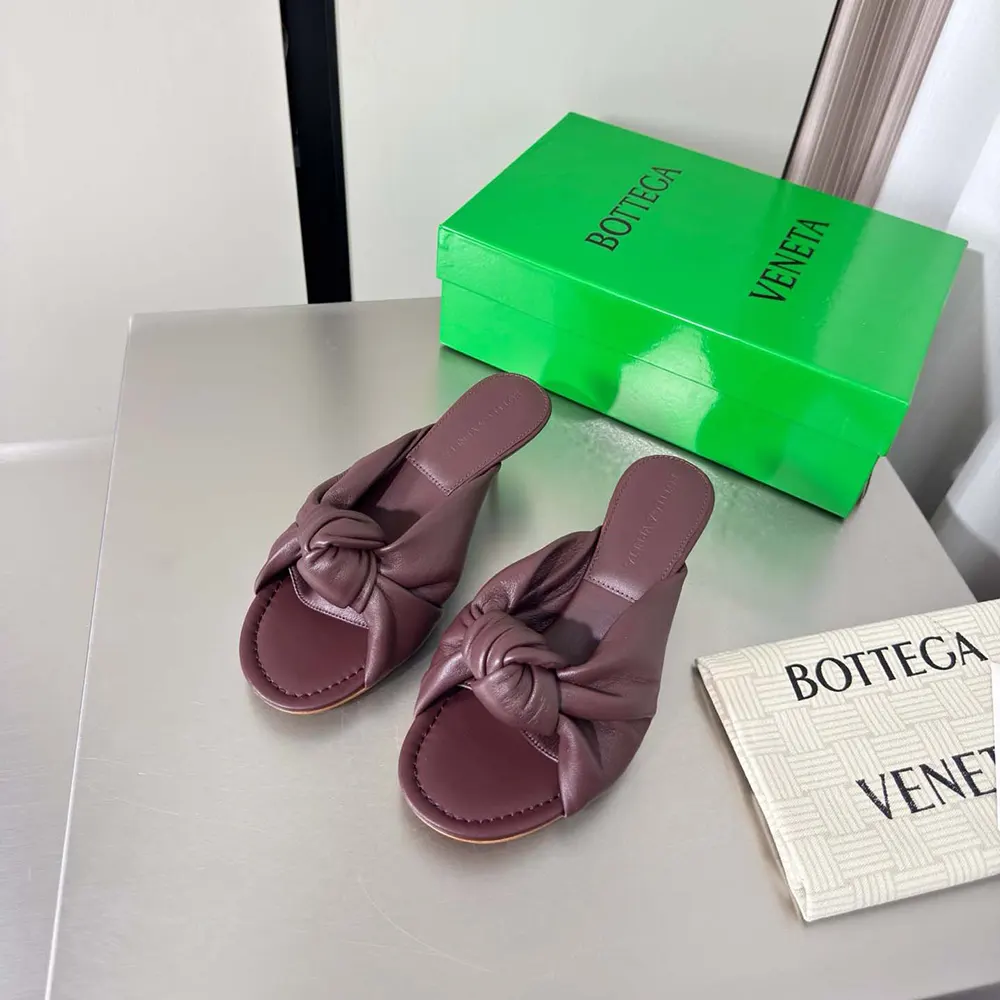 Close-up of supple nappa leather and signature weave on Bottega Veneta mule