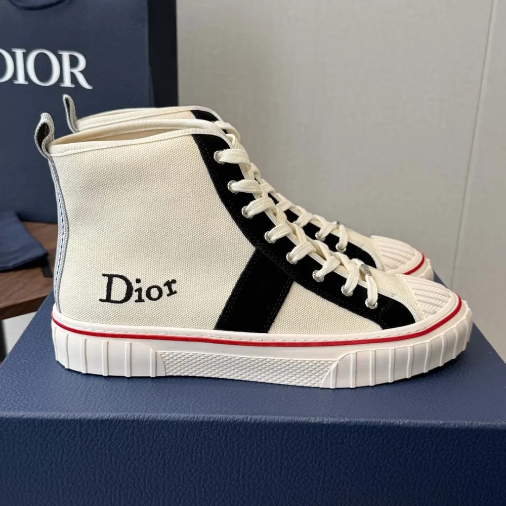 Close-up of navy blue suede and Dior logo on sneaker heel