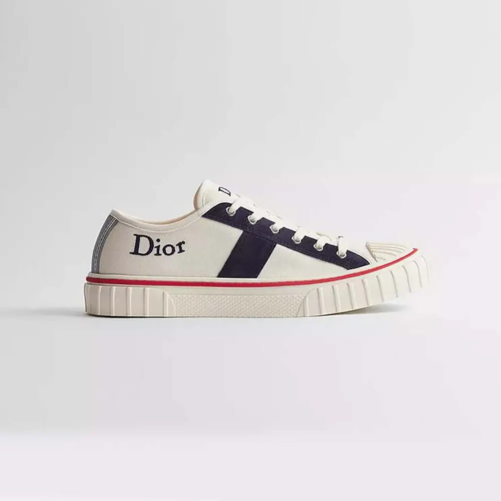 Side view of Dior Unisex Hooper Low-Top Sneaker white canvas navy suede