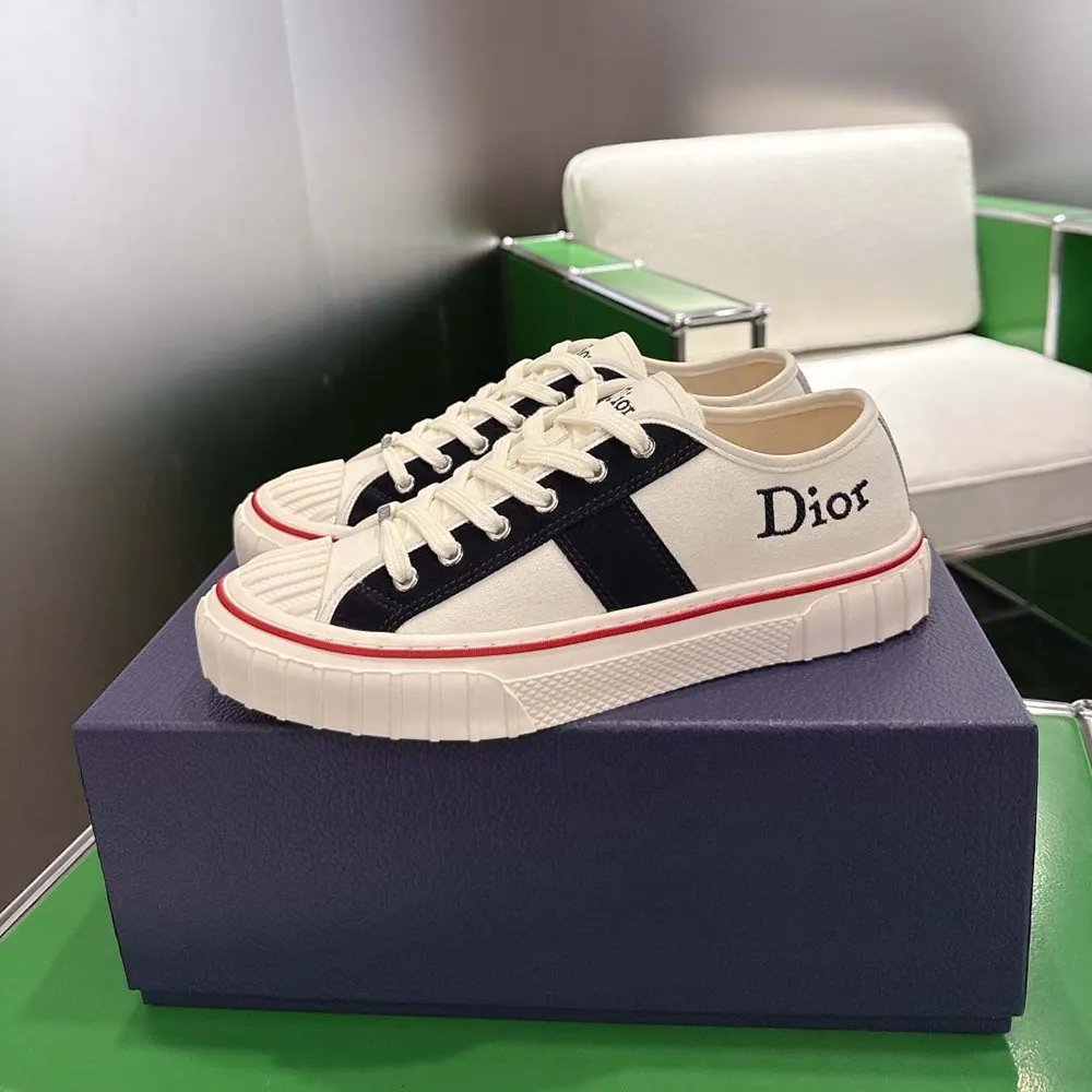 Close-up of Dior Hooper sneaker navy blue suede heel and embossing