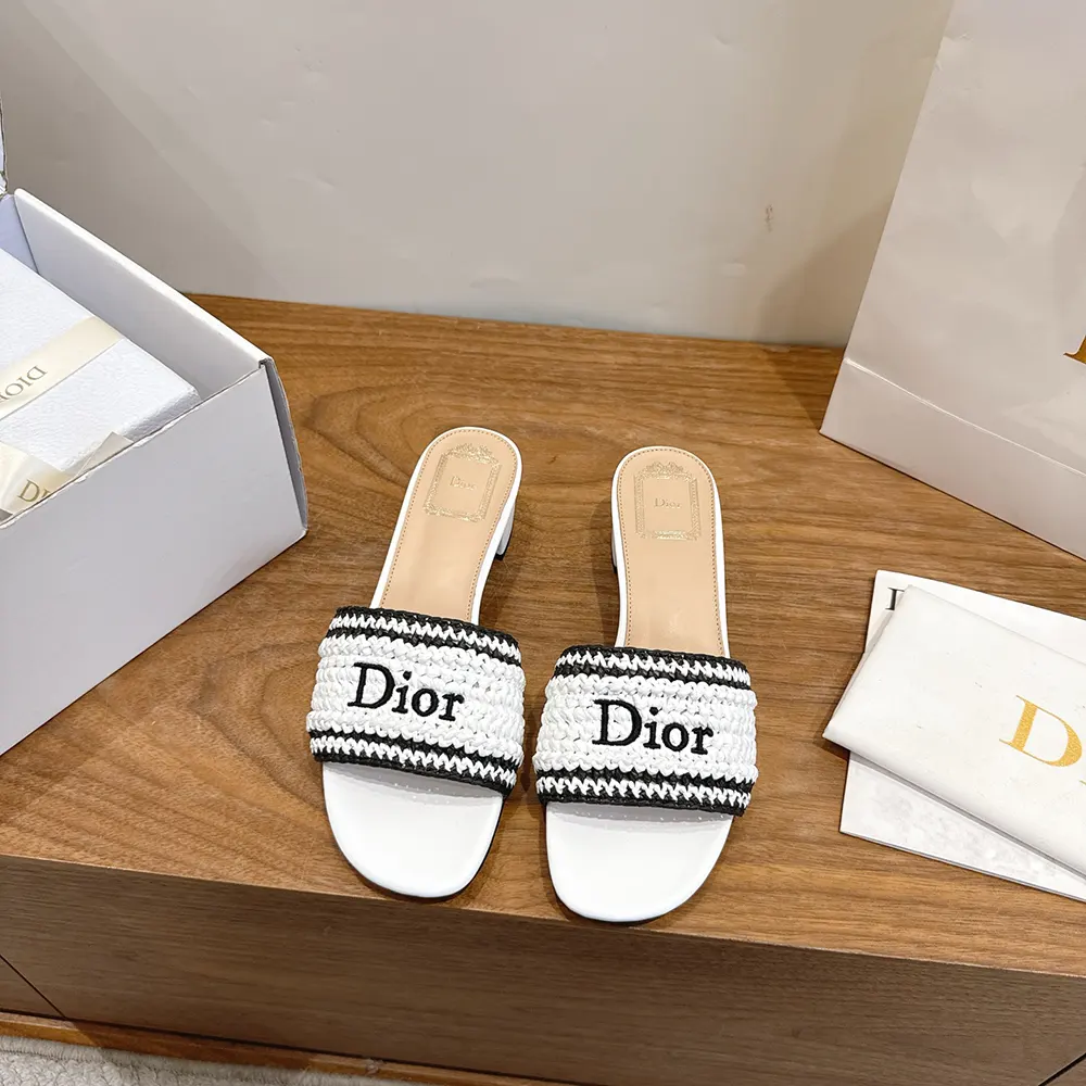 Close-up on woven raffia-effect technical fabric detail of Dior slide