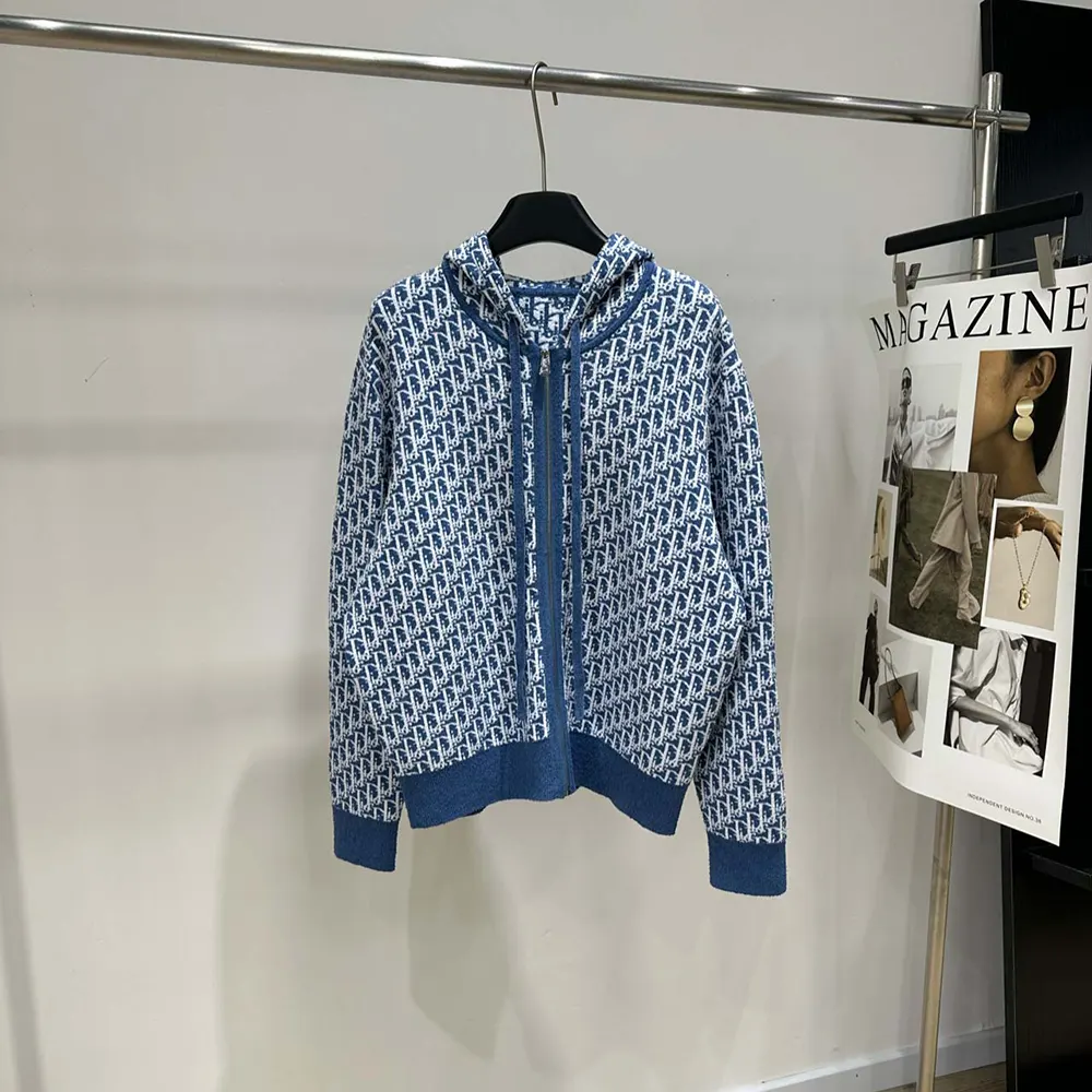 Close-up of Dior Oblique jacquard pattern and zip on Dioriviera cardigan