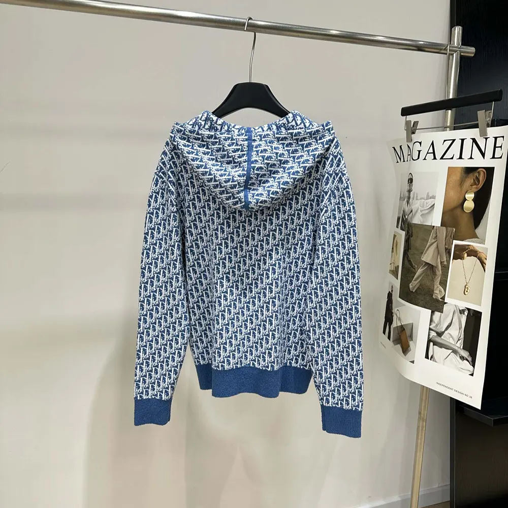 Side profile showing hood and silver hardware on Dior Women Dioriviera cardigan