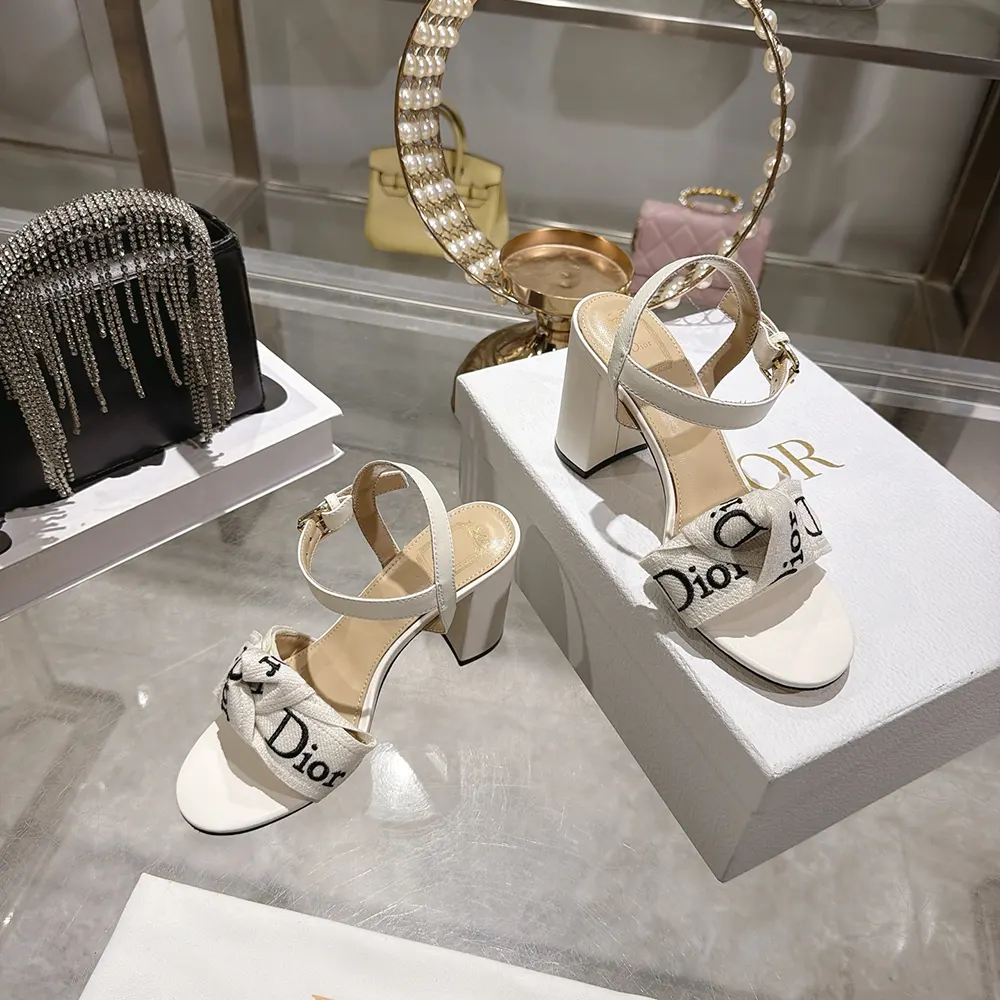 Top angle showcasing adjustable buckle and high heel of Dior J’Adior sandal