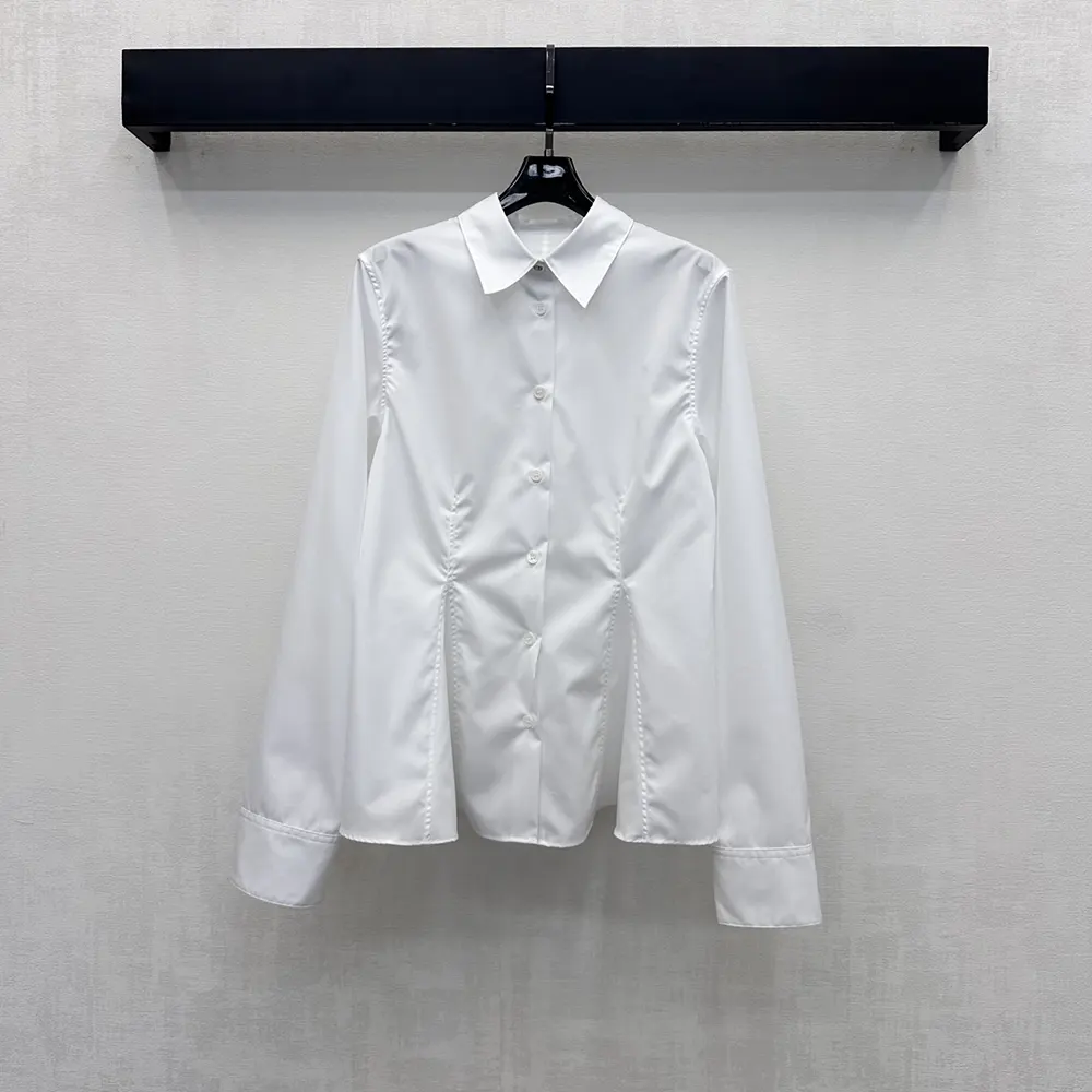 Close-up of button and fabric texture on Dior blouse