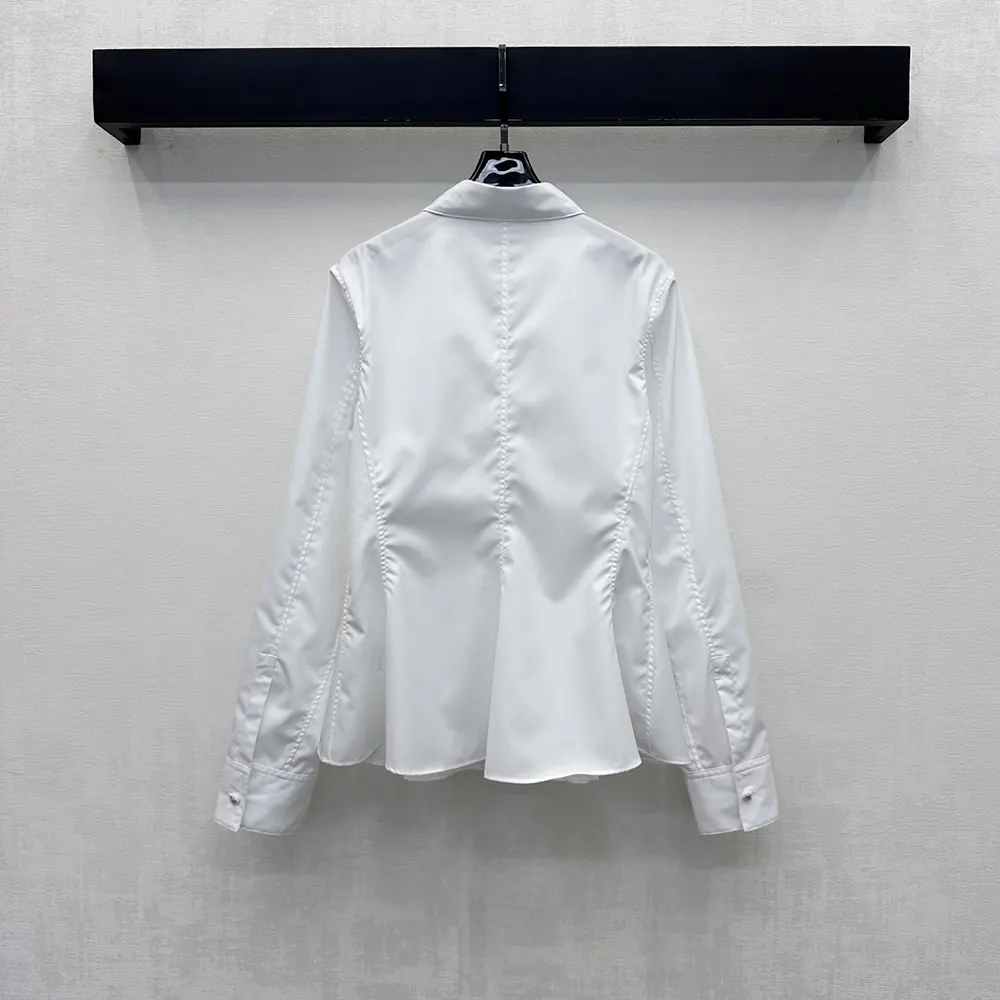 Side angle showing silhouette of Dior Women Peplum Blouse