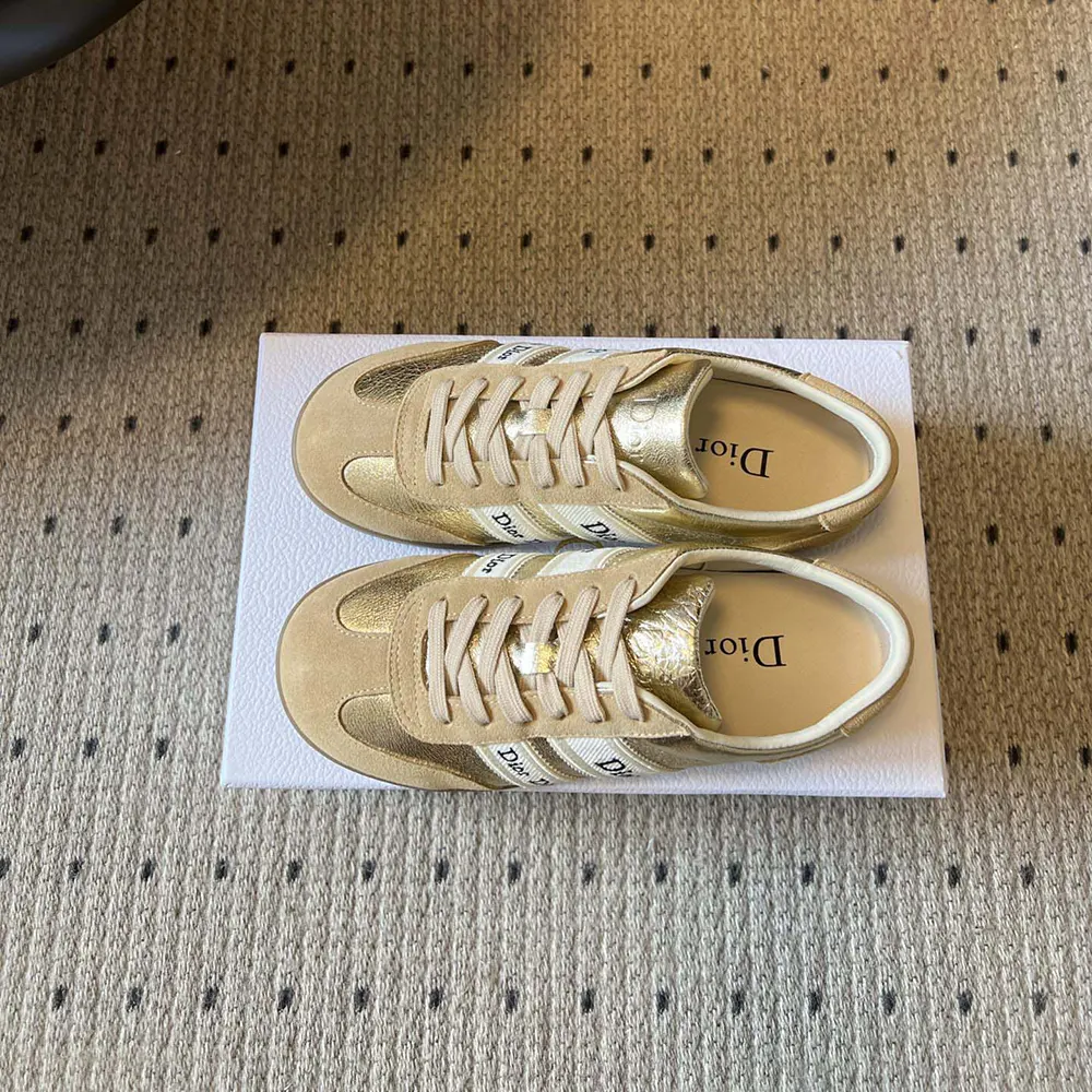 Close-up of gold-tone crinkled laminated lambskin ribbon on Dior Women Ribbon Sneaker