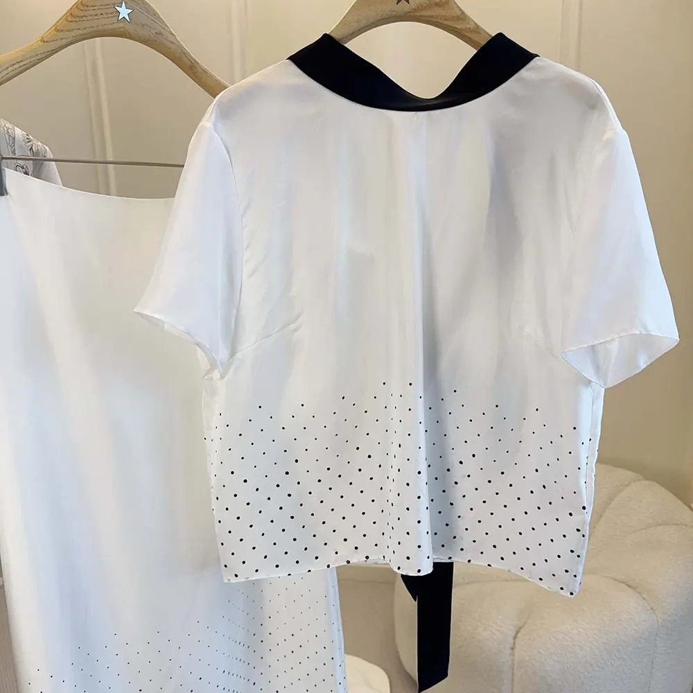 Side angle showing black polkaDior motifs on Dior Women Short-Sleeved Blouse