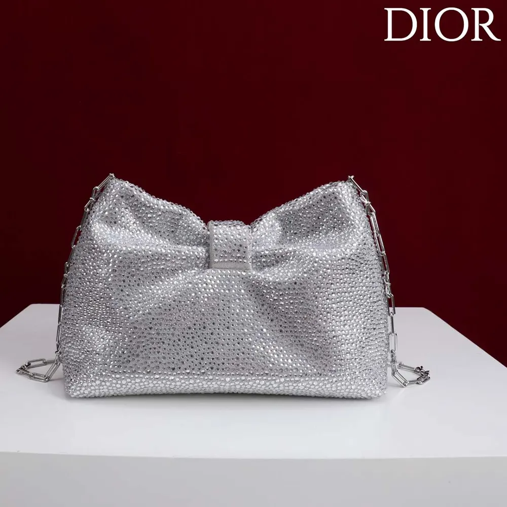 Side angle showing silhouette of Dior Women Small Dior Bow Bag Silver-Tone Goatskin and Strass