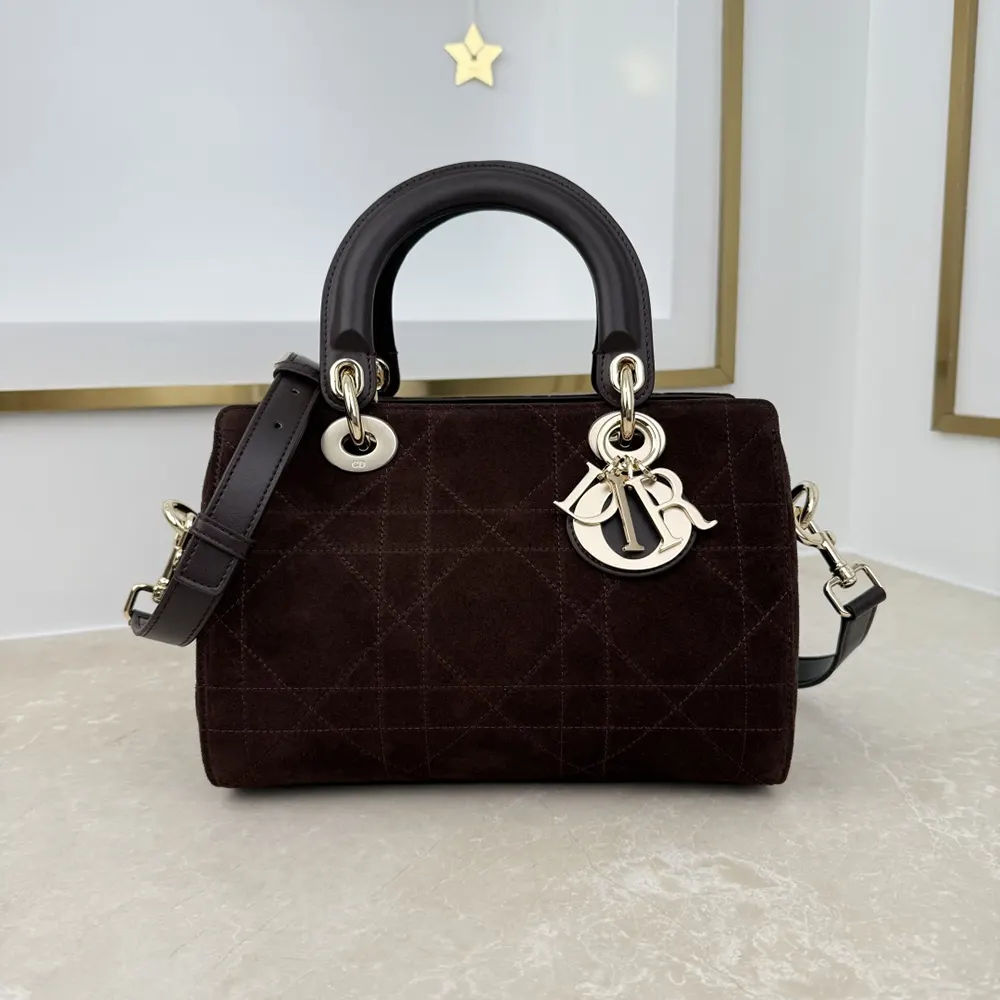 Close-up of gold hardware and Macrocannage stitching on Dior Granville Bag