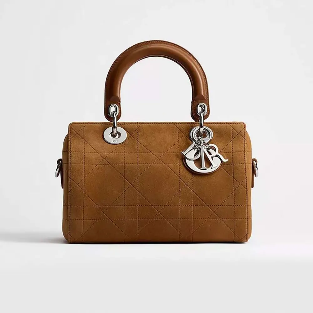 Front view of Dior Women Small Dior Granville Bag Golden Saddle Flat Macrocannage Suede Goatskin