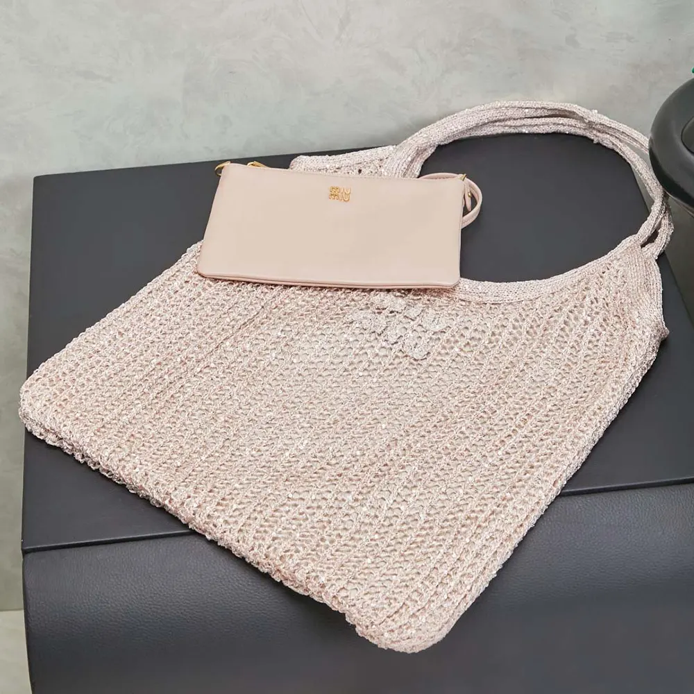 Side angle showing silver hardware on Miu Miu Women Ivy Sequin Mesh Bag Powder Pink