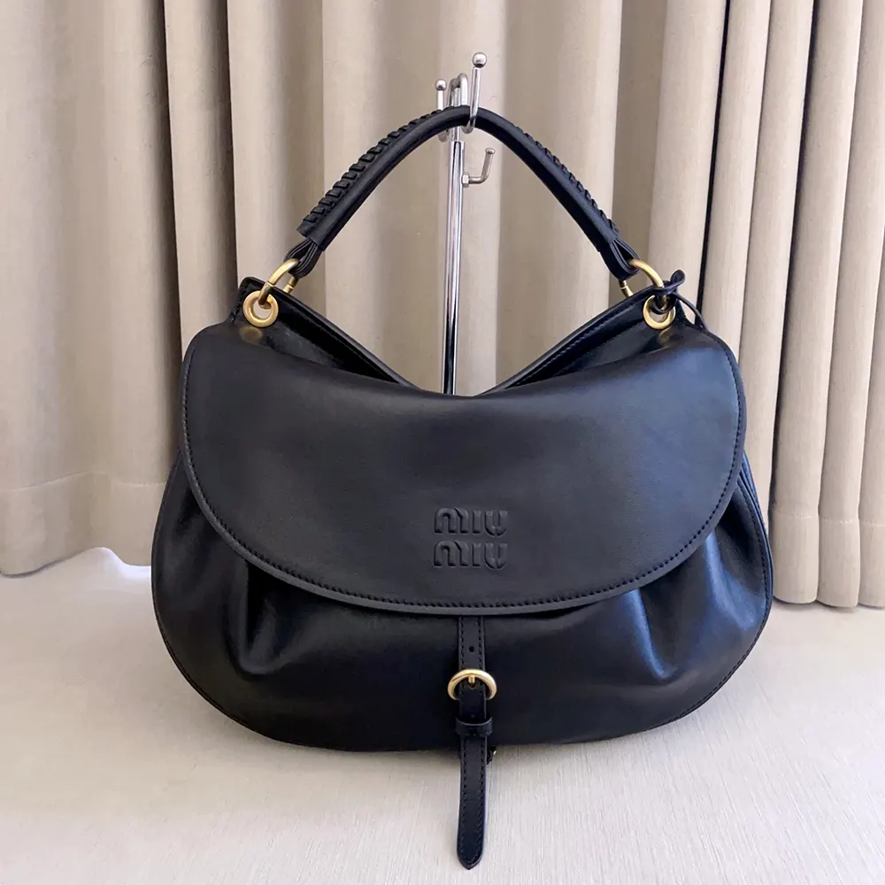 Close-up of silver-tone hardware on Miu Miu Women Rendez-Vous Leather Bag Black