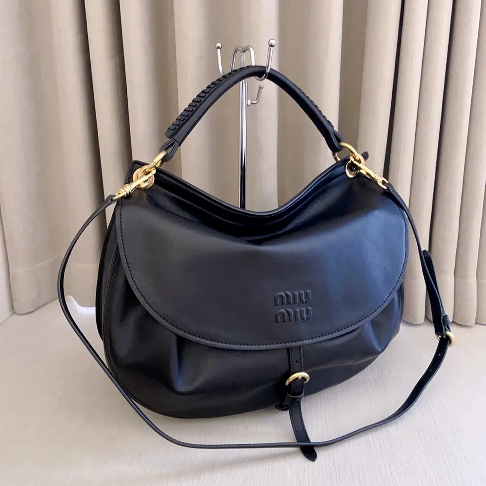 Side angle showing silhouette of Miu Miu Women Rendez-Vous Leather Bag Black