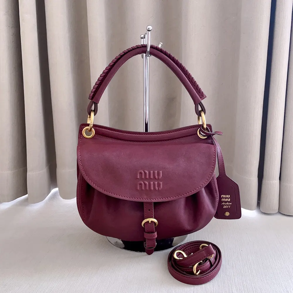 Close-up of gold-tone hardware on Miu Miu Women Rendez-Vous bag