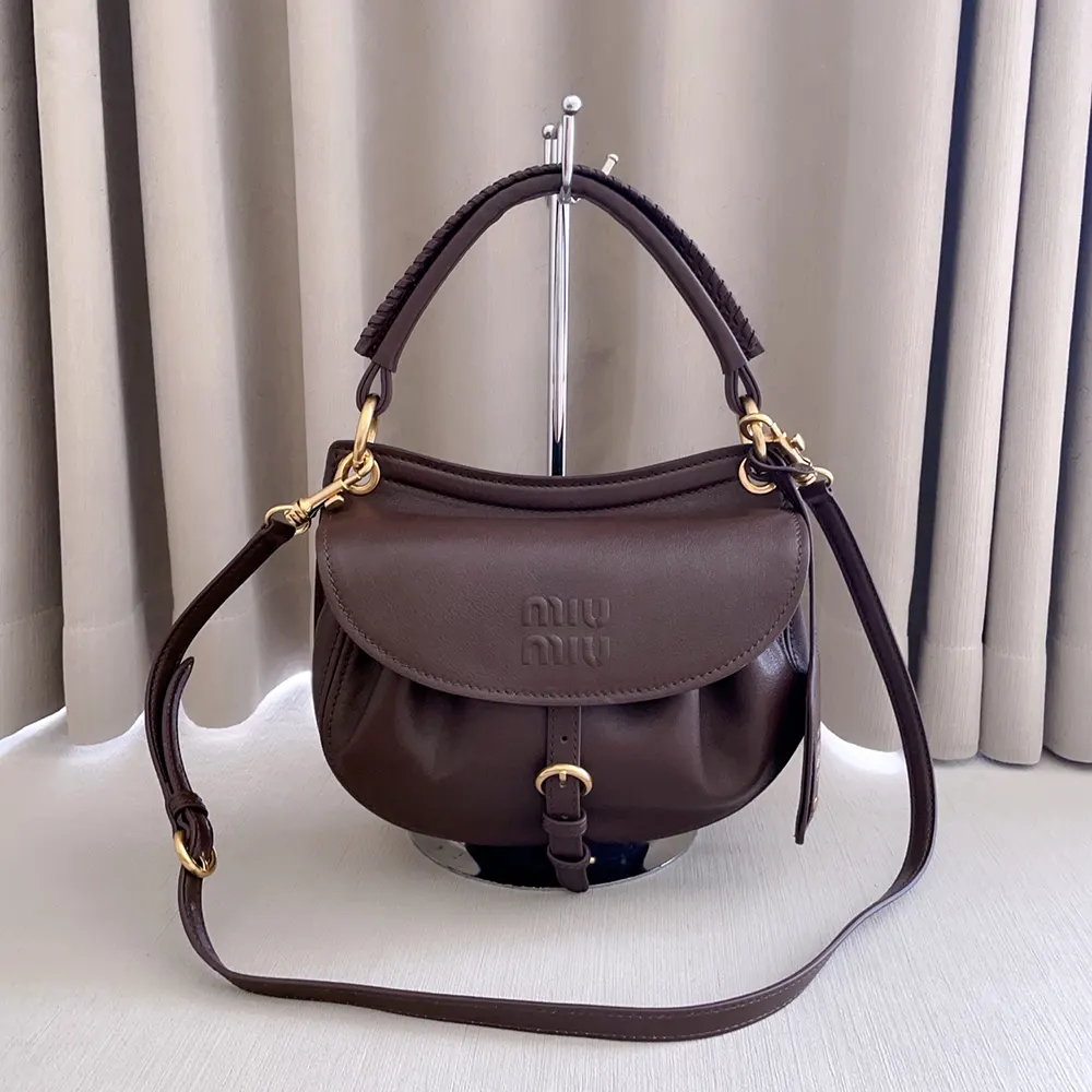 Close-up of gold-tone hardware on Miu Miu Women Rendez-Vous Nappa Leather Bag Briarwood