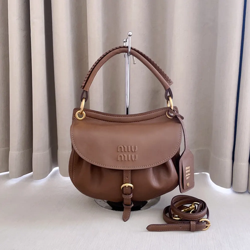 Side angle of Miu Miu Women Rendez-Vous Nappa Leather Bag Oak highlighting silhouette