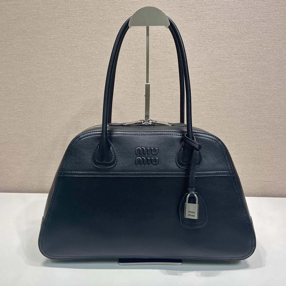 Close-up of silver hardware and leather texture on Miu Miu Women Vivant Leather Bag Black