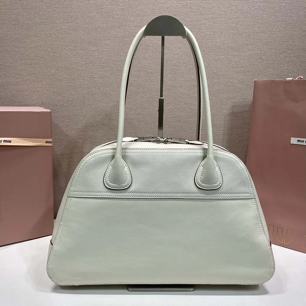 Side profile of Miu Miu Women Vivant Leather Bag Chalk White with strap
