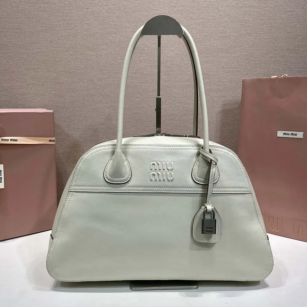 Close-up of smooth calfskin leather and silver hardware on the bag