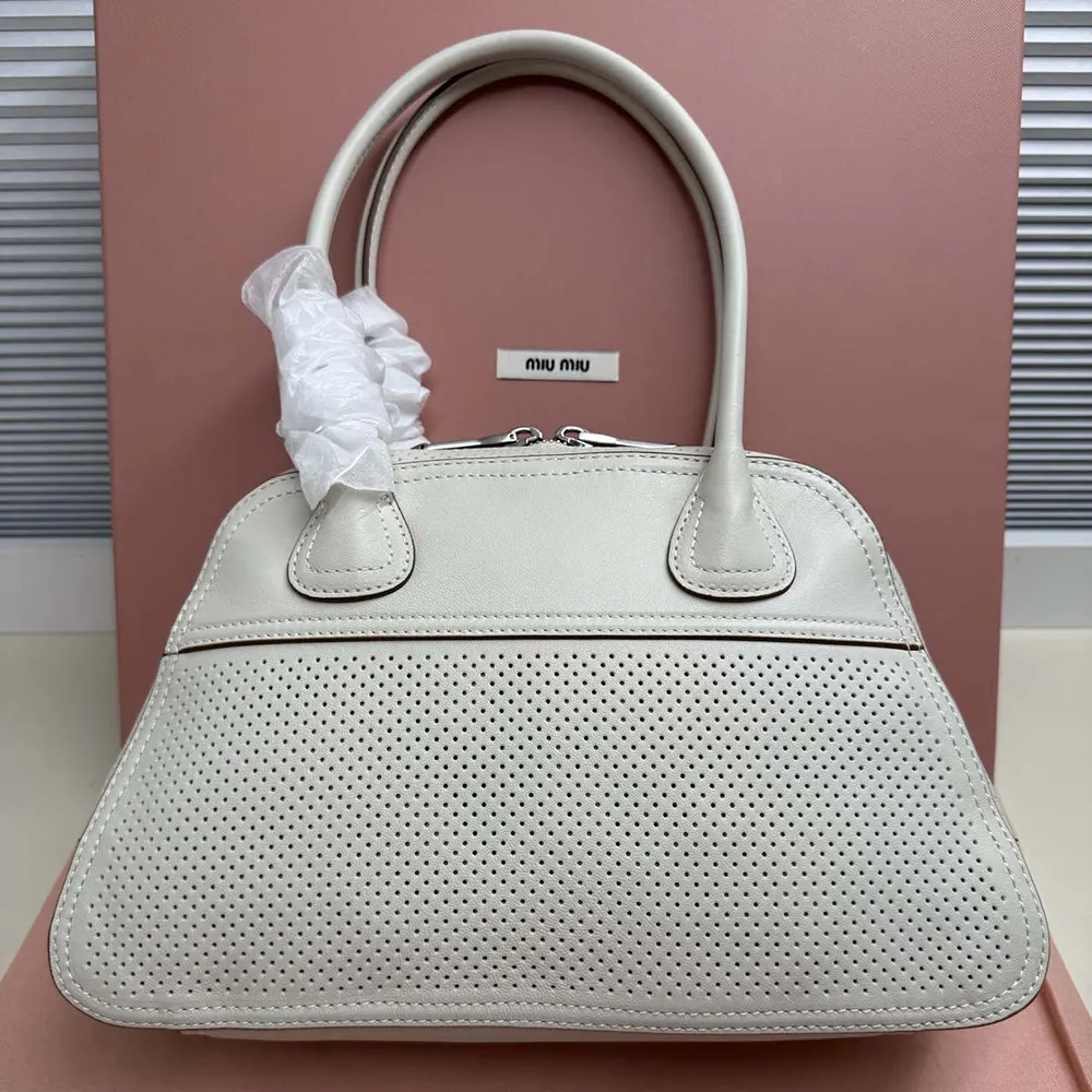 Side profile showing adjustable strap on Miu Miu Women Vivant Leather Bag Chalk White