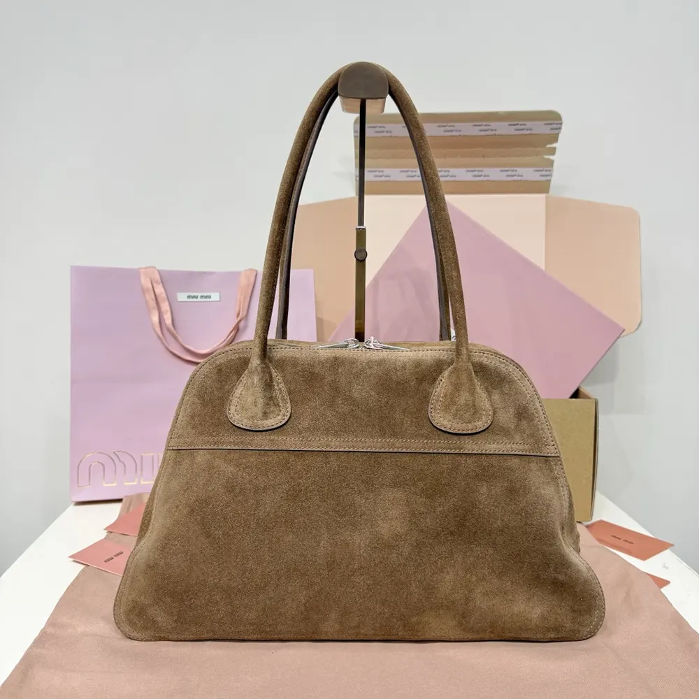 Side profile showing suede texture of Miu Miu Women Vivant Suede Bag-Cocoa Brown