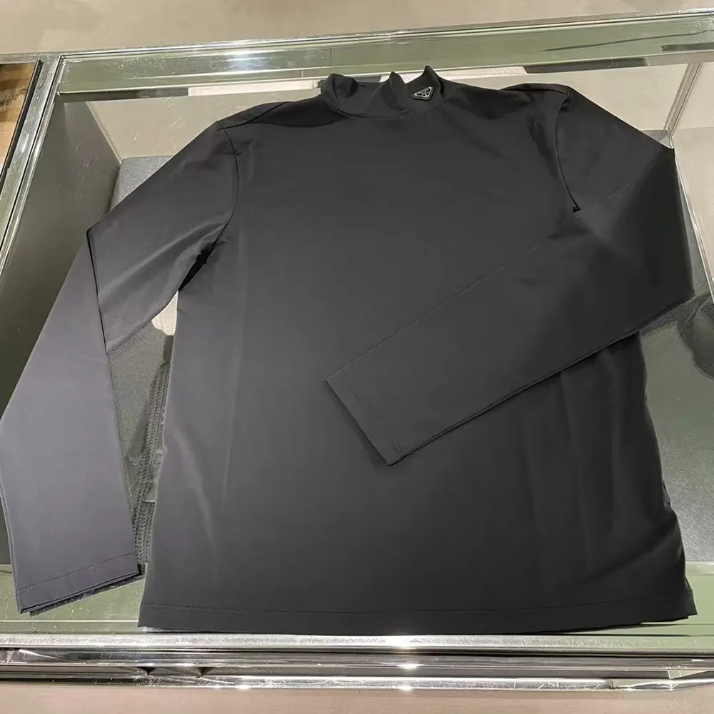 Close-up of mock-neck and tonal logo on Prada Men Tech Jersey Sweater