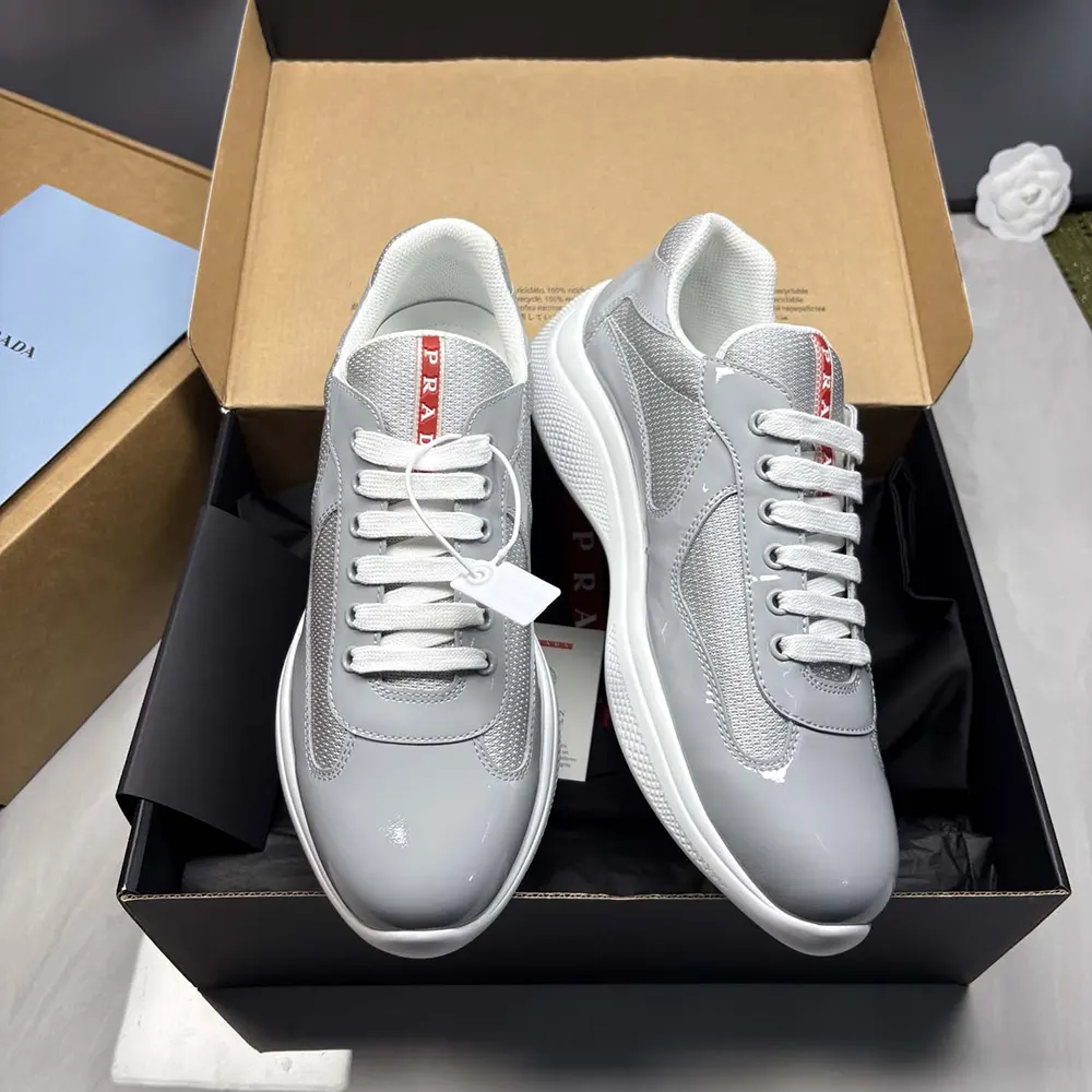 Close-up on metallic leather and bike fabric detail on Prada sneakers