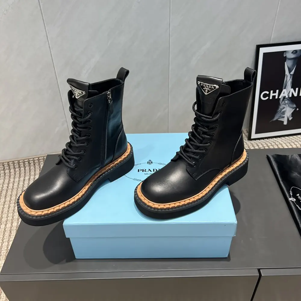 Side view of Prada Unisex Black Leather Lace-Up zip up Combat Boots