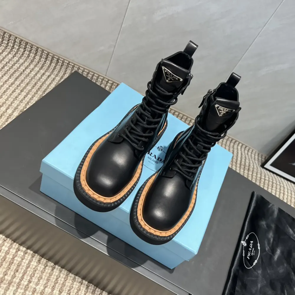 Front angle showing laces and chunky sole of Prada combat boots