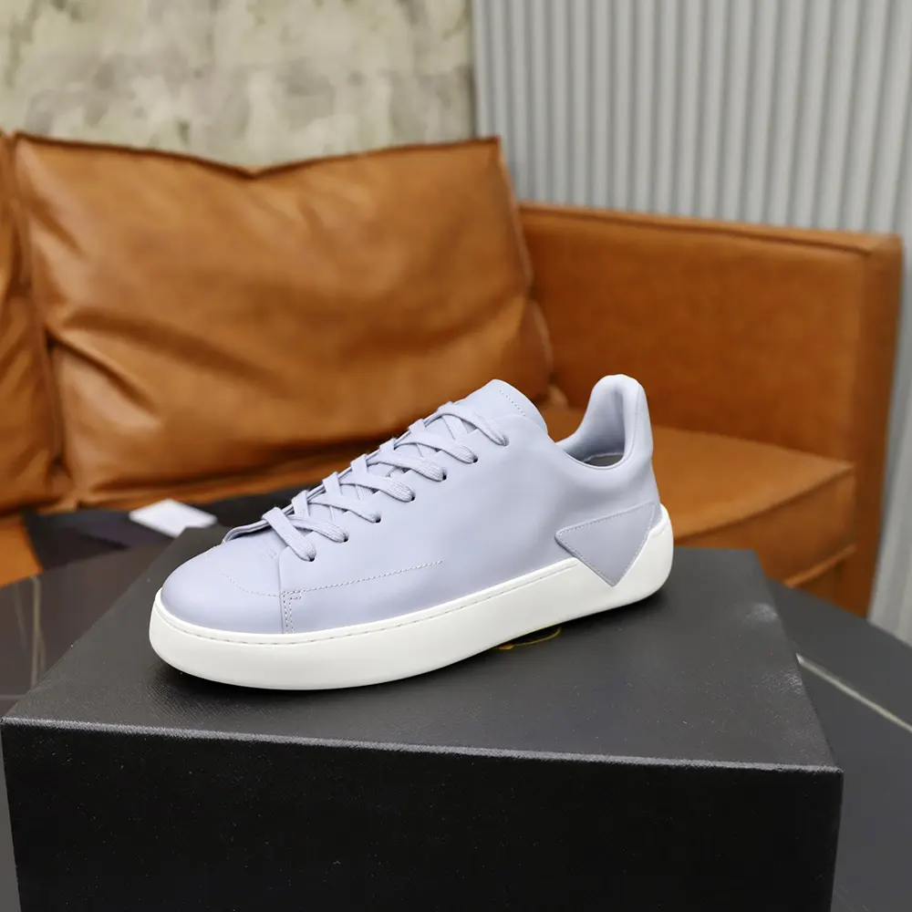 Close-up of pearl gray leather texture on Prada Unisex Court Sneakers