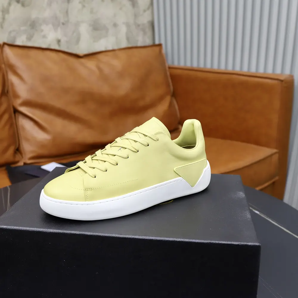Side profile showcasing silhouette of Prada Unisex Court Leather Sneakers-Pineapple